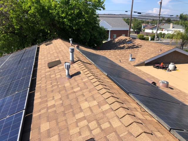  A roof is covered with solar panels installed by Streamline Roofing in the San Diego area 