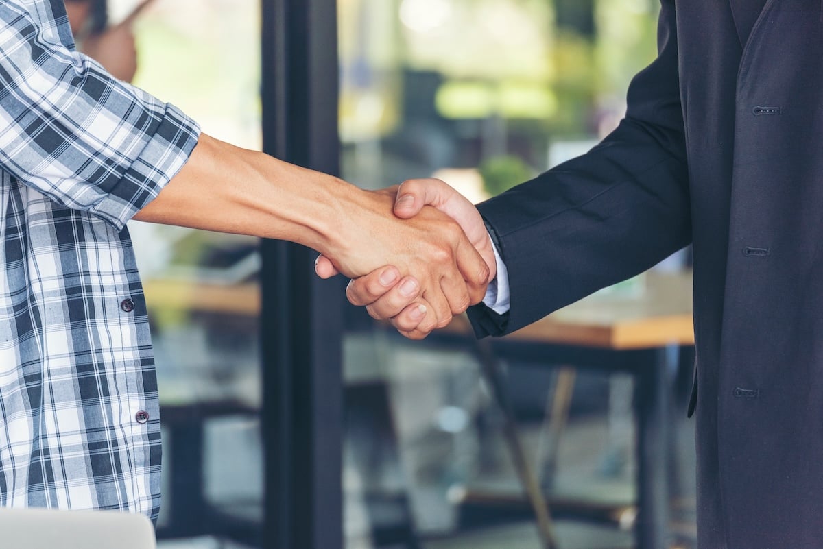 shaking hands with contractor and business owner