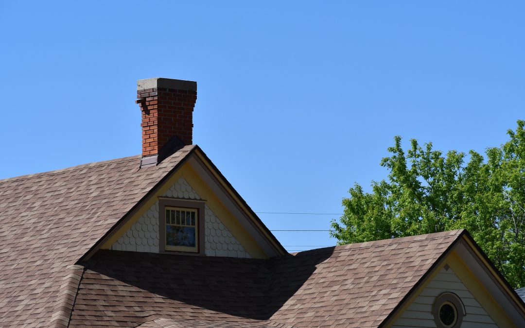 Historical home roofline. Beautiful brick chimney.