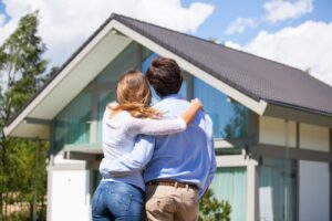 couple looking at finished house