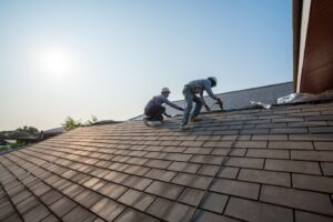 Roofer worker in work wear and gloves