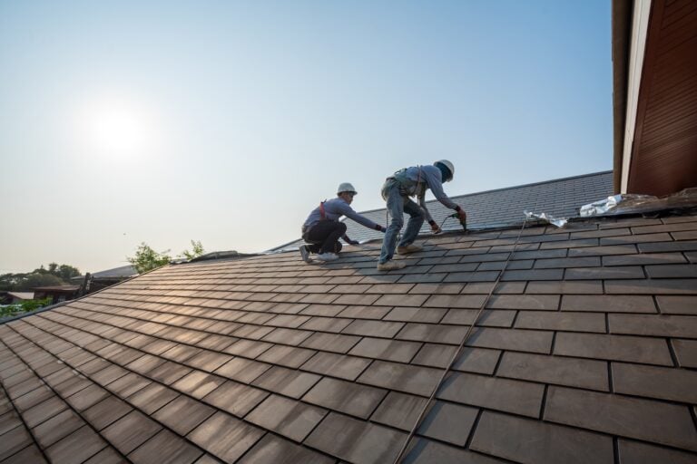 Roofer worker in work wear and gloves