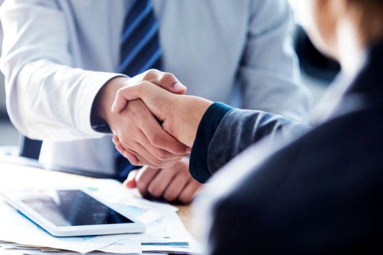 Business handshake in the office / commercial roofing chula vista