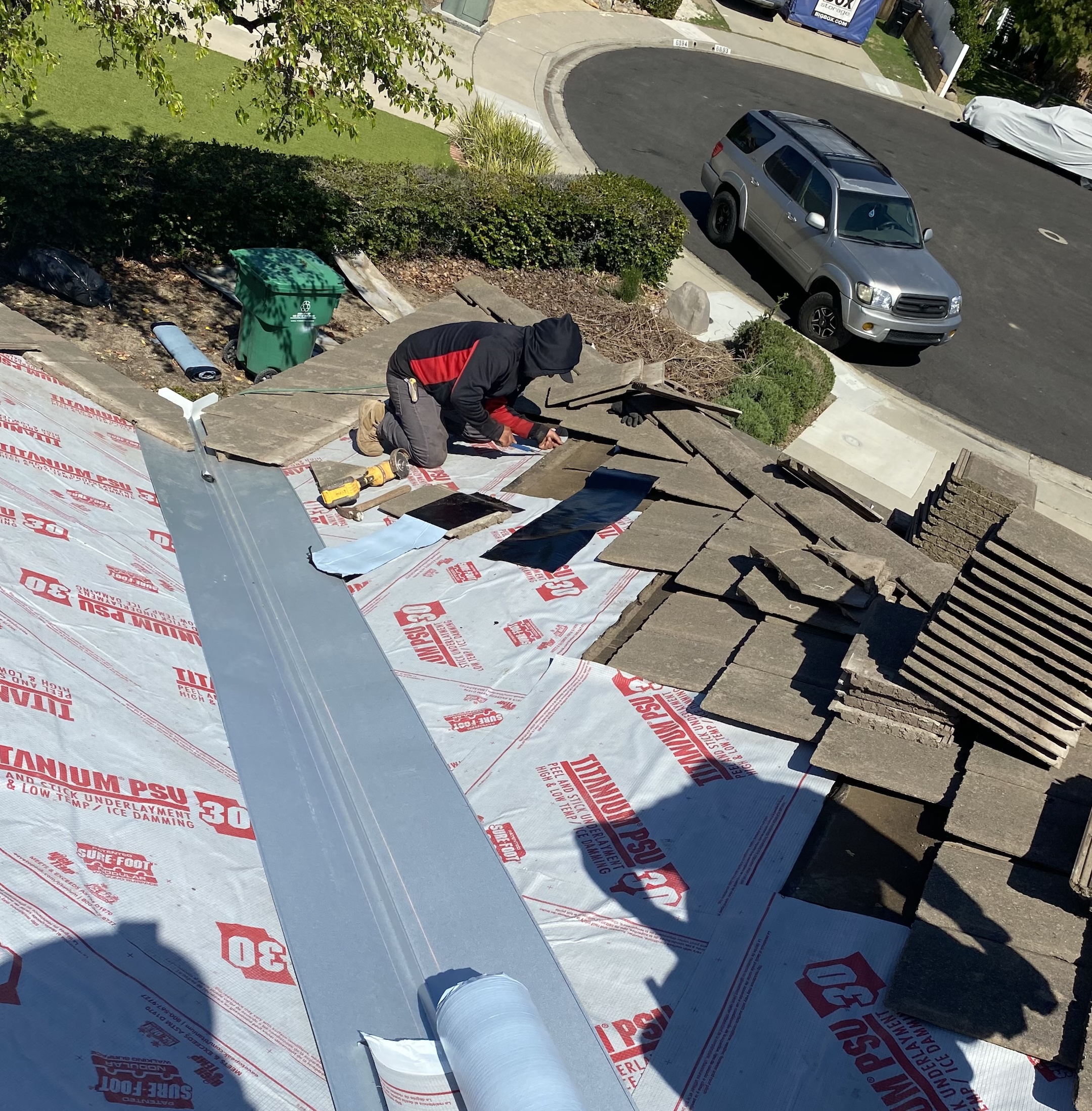 Streamline roofing team working on roof