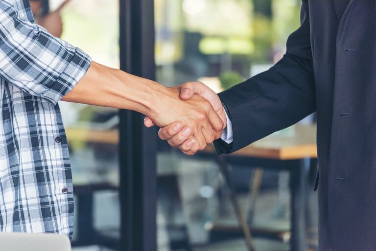 two men shaking hands / commercial roofing la mesa