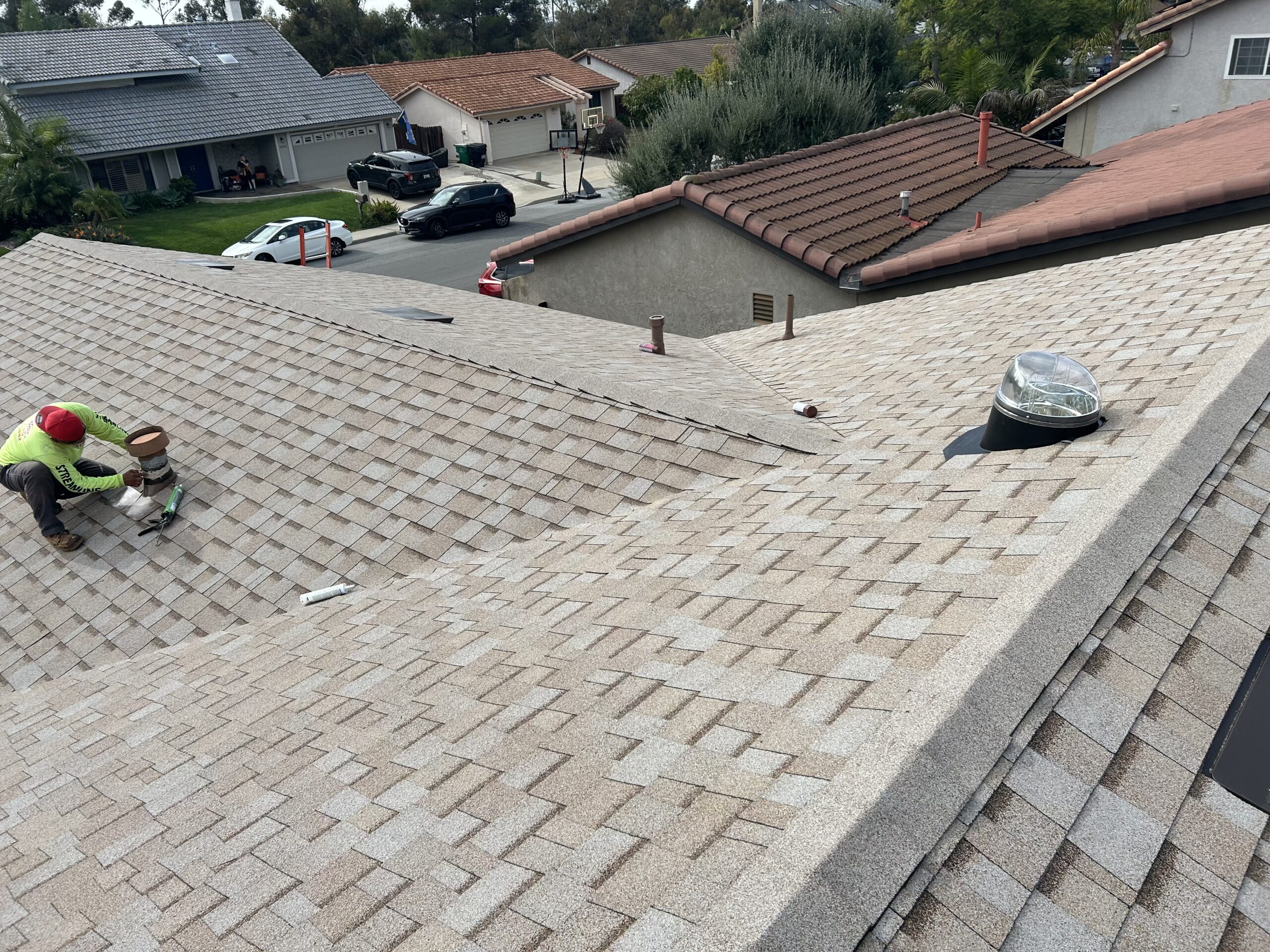 Streamline roofer working on a shingle roof