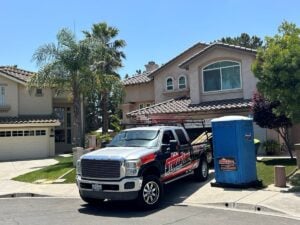 residential roofing contractors branded truck outside Streamline roofing project house