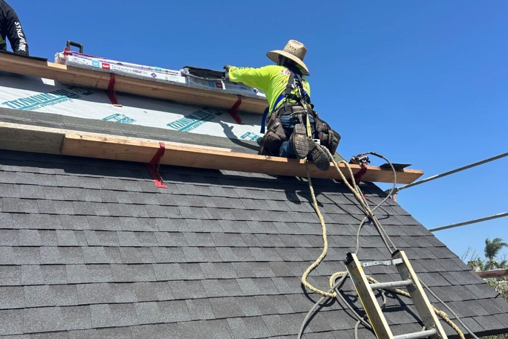 roof shingle replacement Streamline Roofing project worker