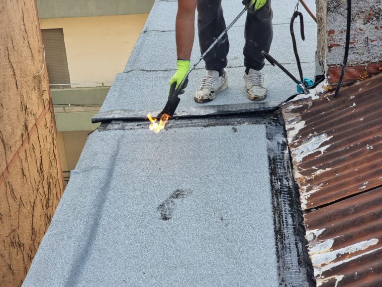 roof waterproofing tarmac terrace insulation waterproof instalation worke working on the roof of a building maintenance