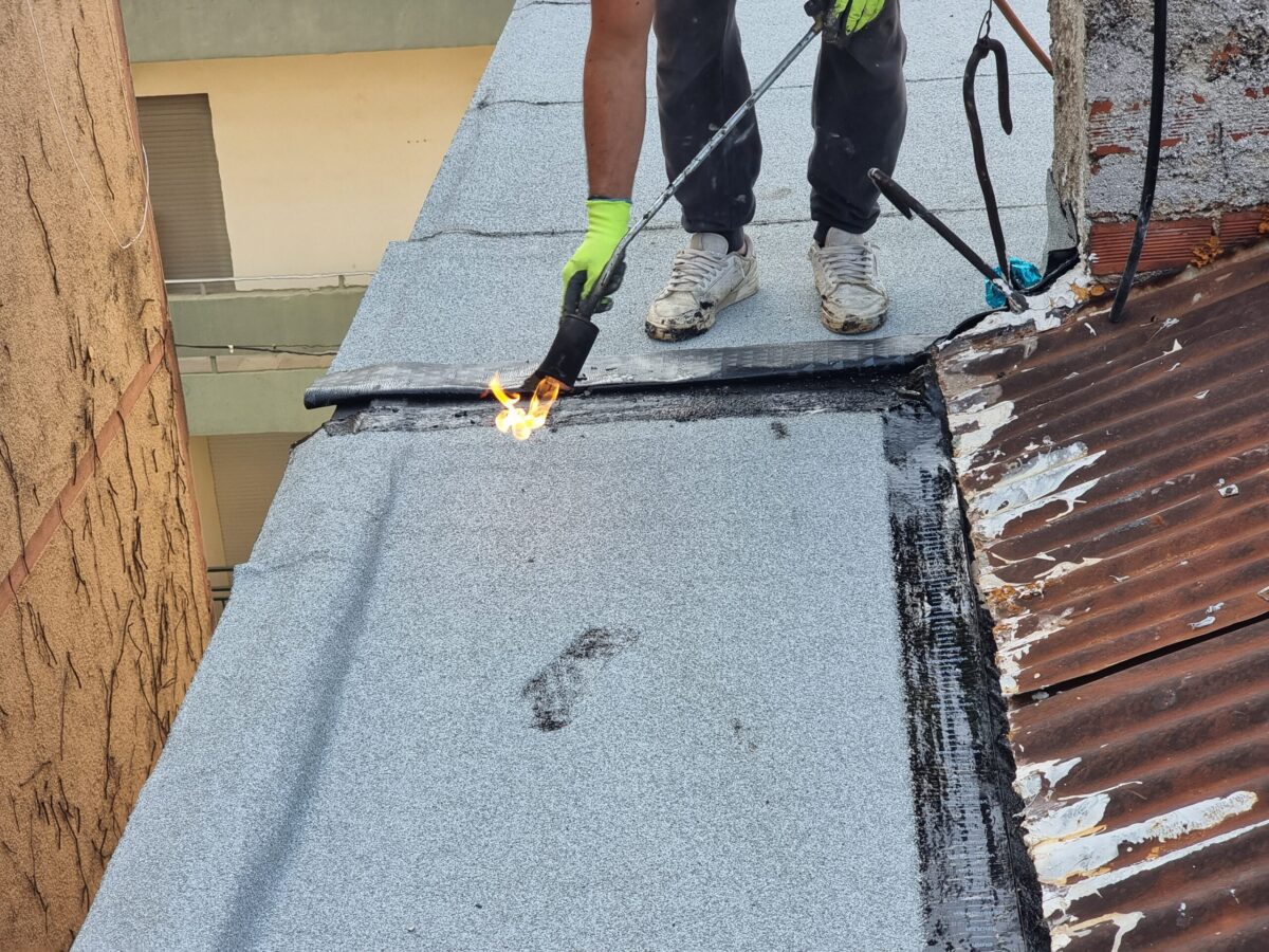 roof waterproofing tarmac terrace insulation waterproof instalation worke working on the roof of a building maintenance