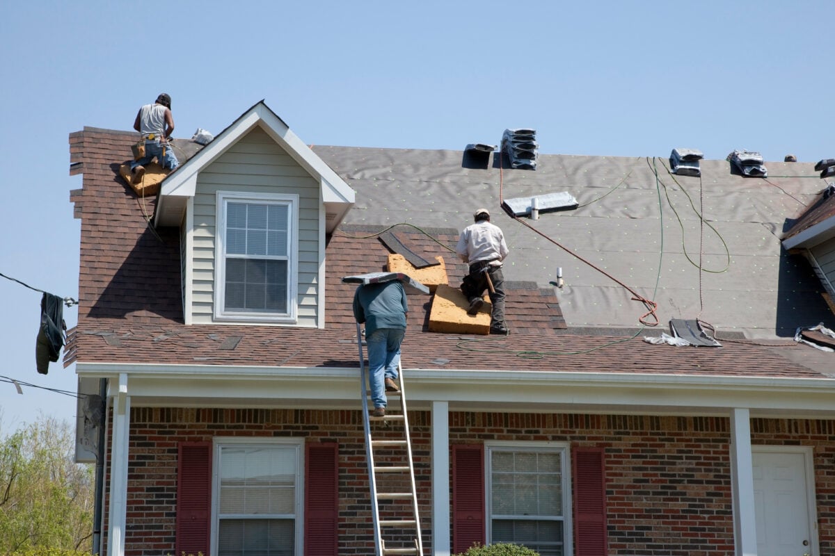  workers on top of shingles