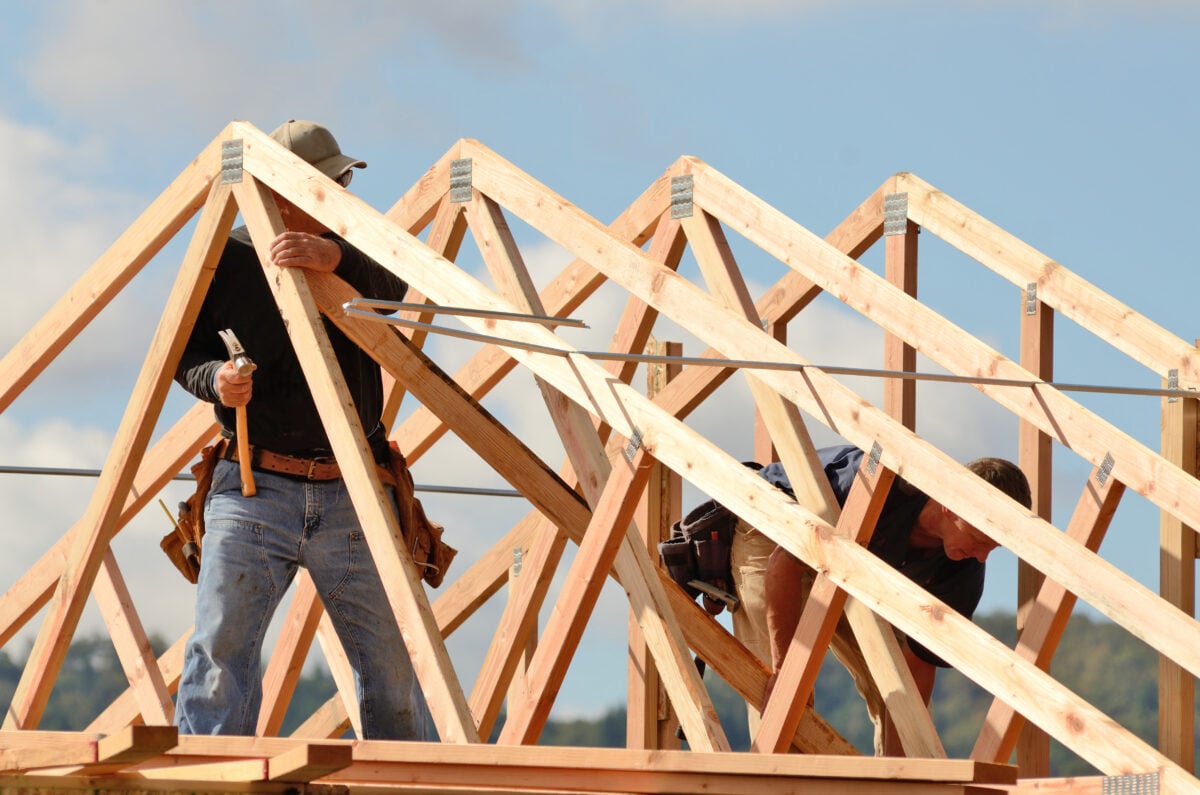 roof truss Layout and installation of roof rafters on a new commercial residential construciton project by framing contactors