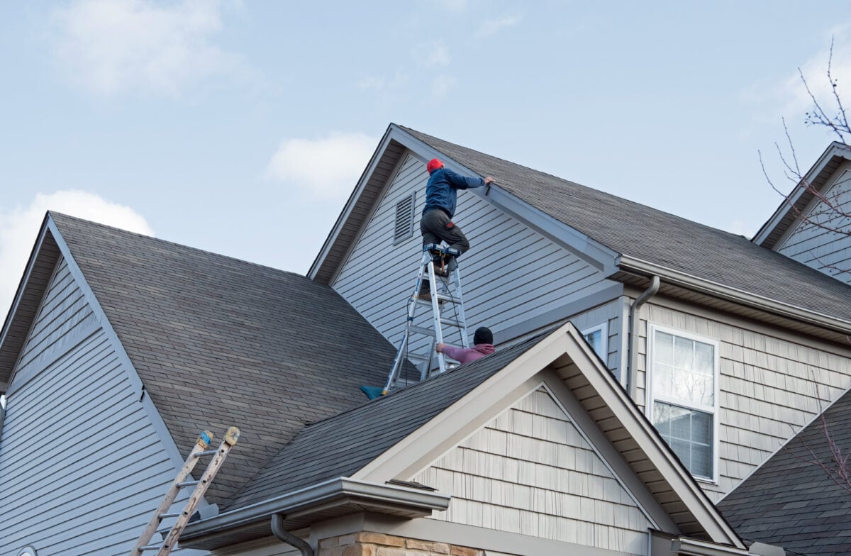 guy inspecting roof