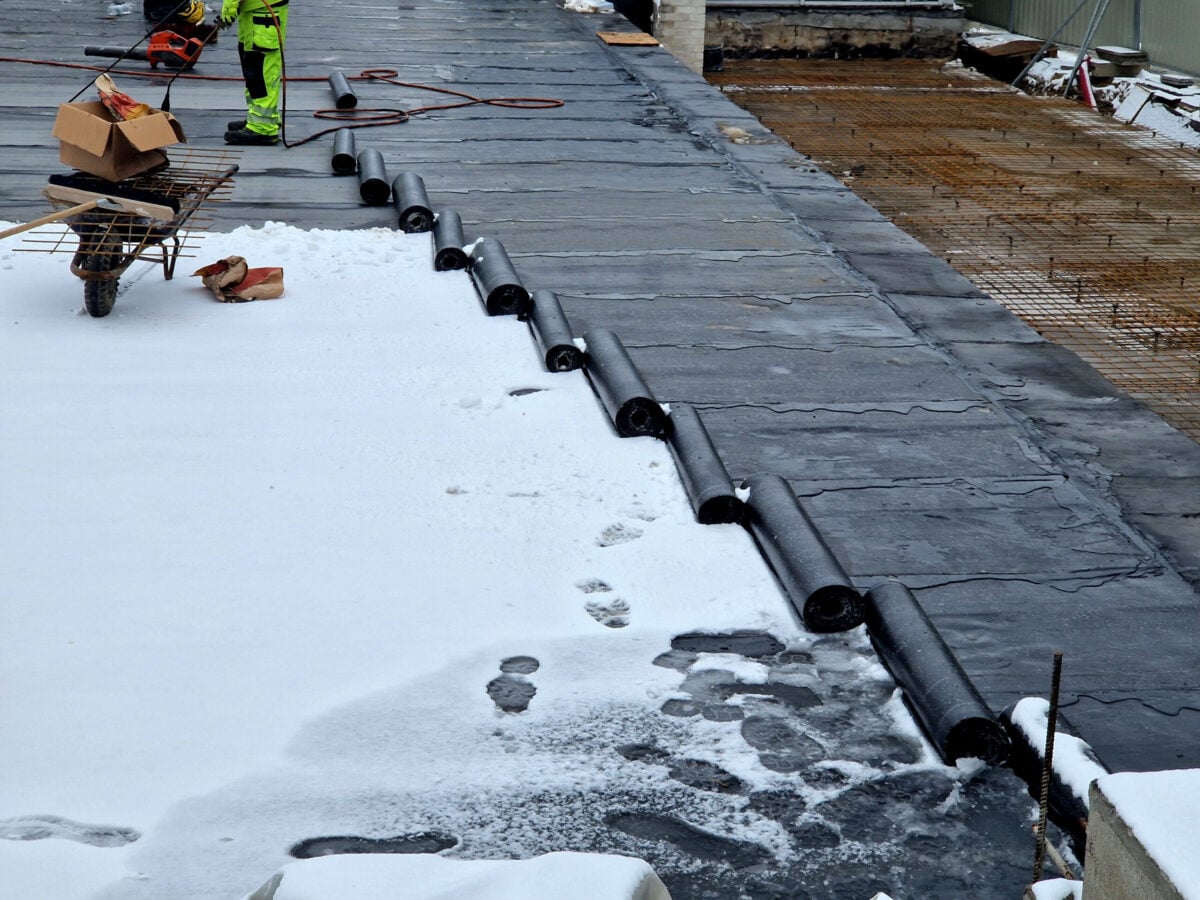 guy installing new roof